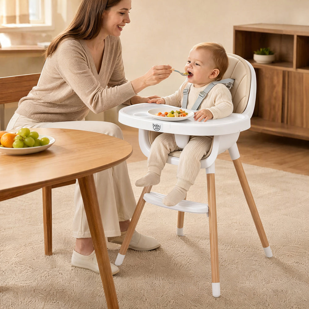 Convertible high chair in beige with beech wood legs, featuring a 5-point harness and removable double tray for easy feeding.