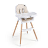 Convertible high chair in beige with beech wood legs, 5-point harness, and removable double tray for easy feeding.