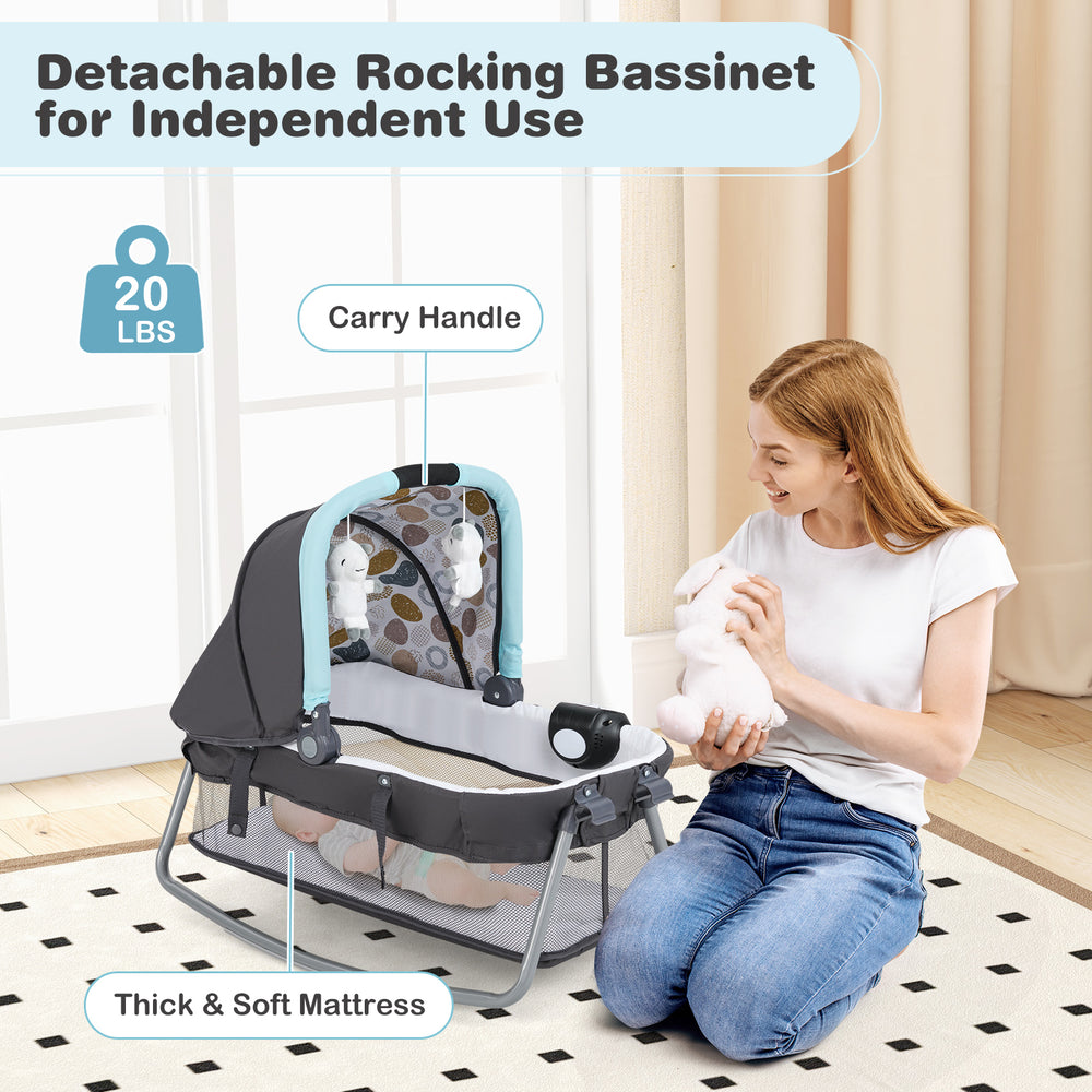 Detachable rocking bassinet in blue with carry handle, soft mattress, and safety features for newborns.