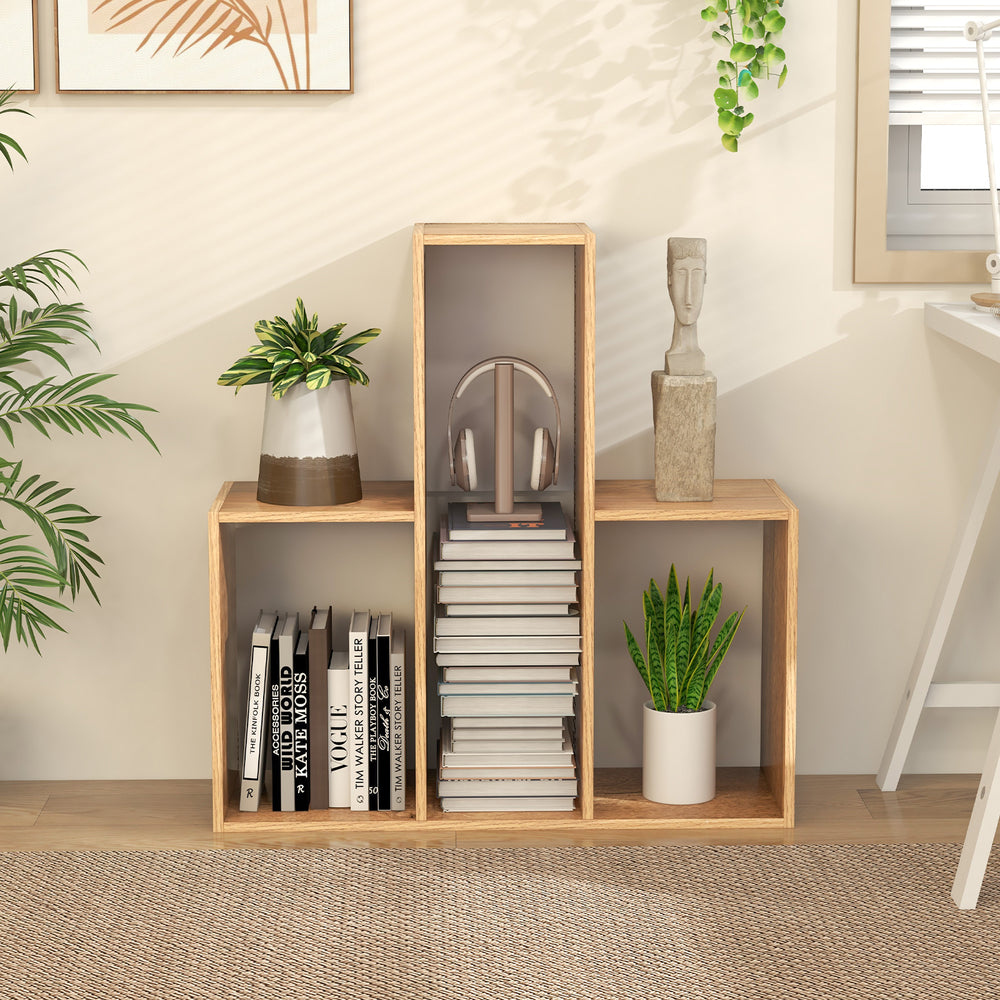 Convex bookshelf featuring a geometric design with three open shelves, ideal for organizing books and decor in any room.