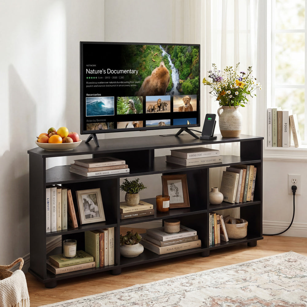 Corner entertainment center TV stand in black, holding a TV and books, with ample storage and adjustable shelves.