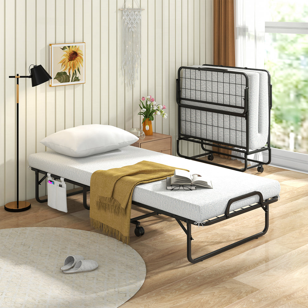 Folding cot bed with memory foam mattress and pillow, featuring a space-saving design and side storage pocket for.