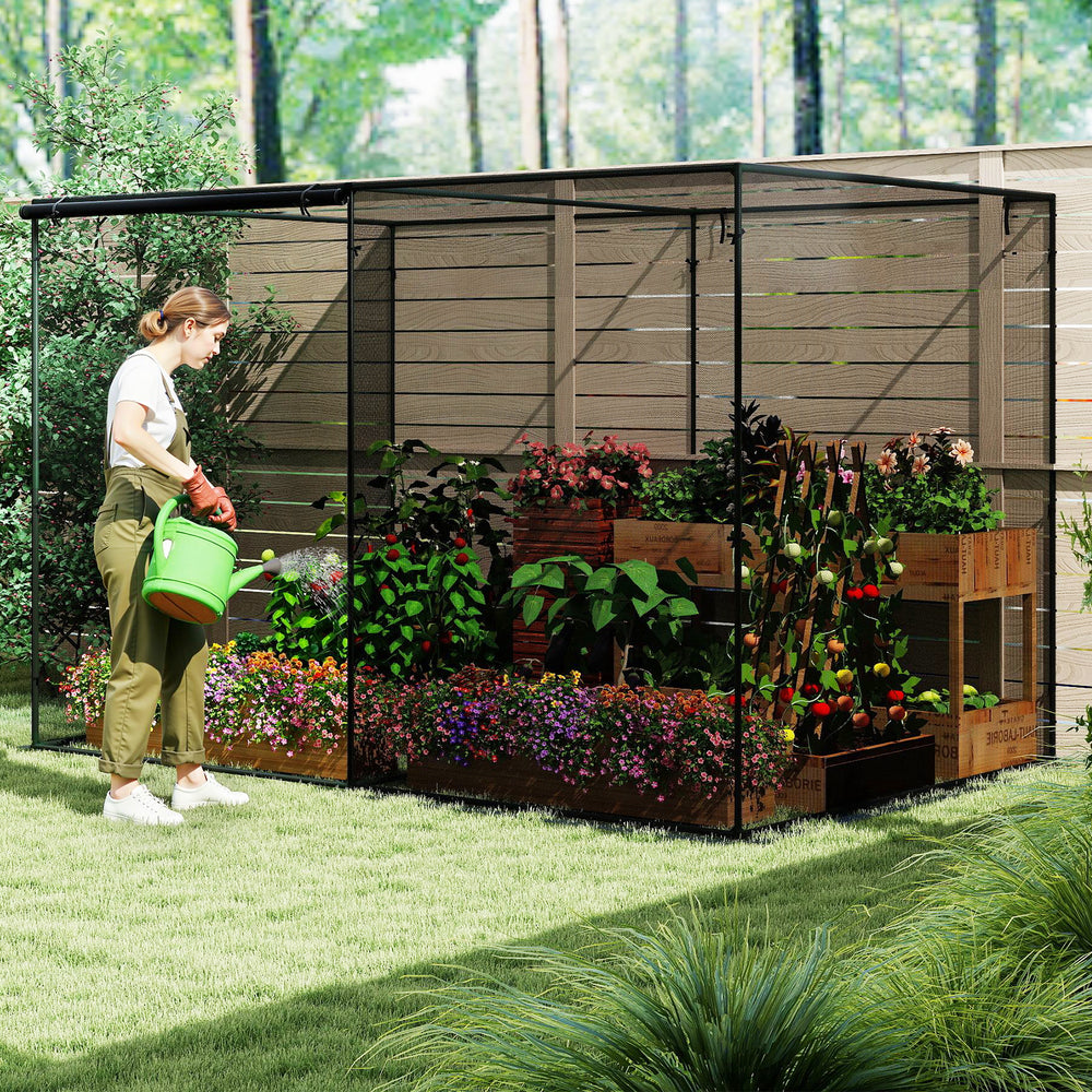 Large crop cage with tear-resistant mesh, 10 x 6.5 x 6.5 ft, providing plant protection in a garden setting.