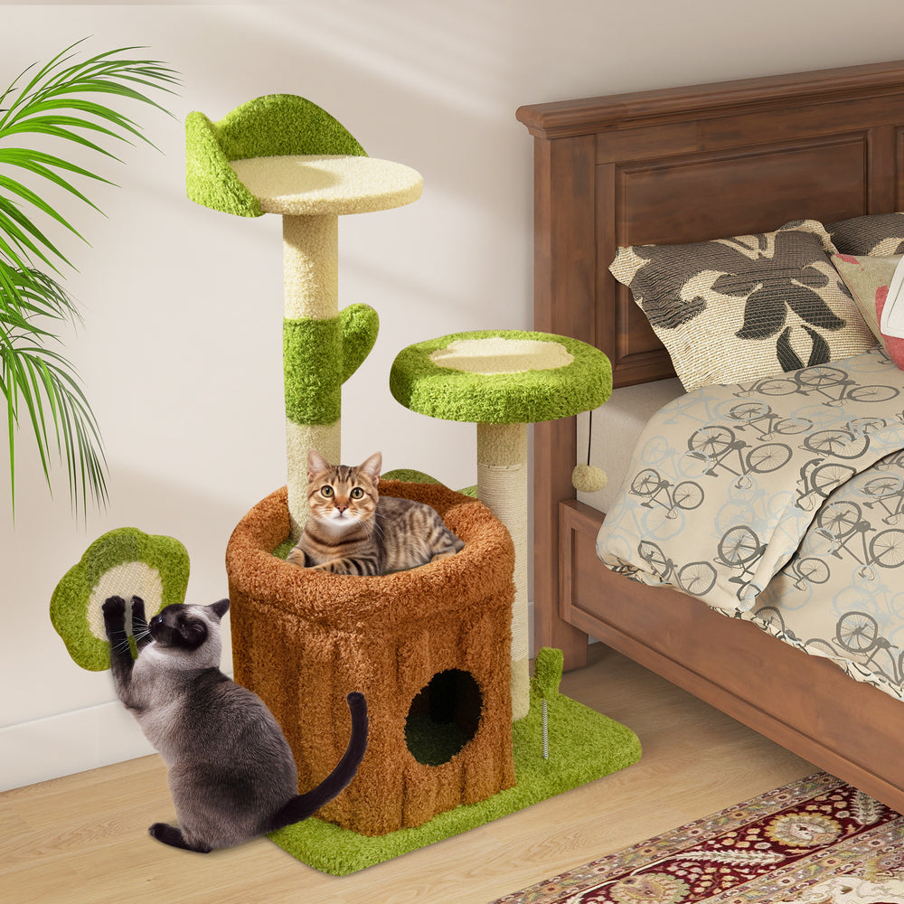 Cat tree activity center in green with trunk condo, padded perches, and scratching posts for indoor play and relaxation.