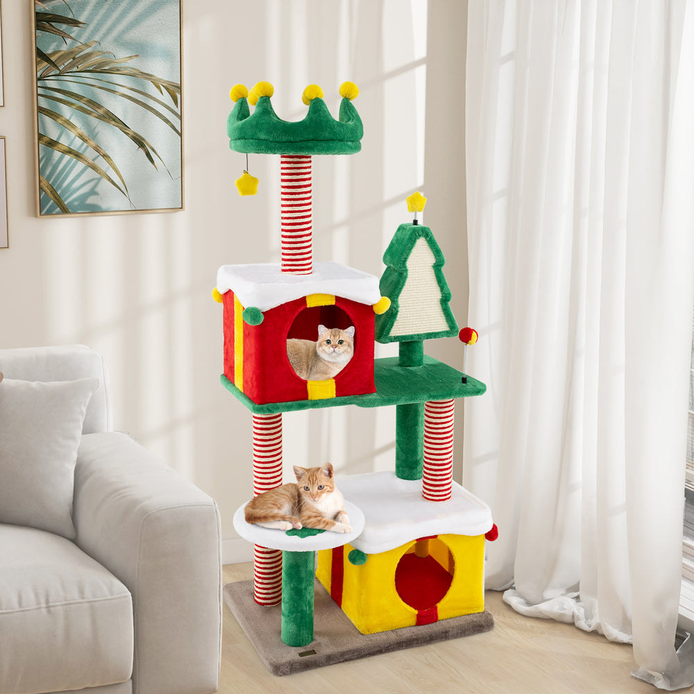 Multicolor Christmas cat tree with gift box condos, scratching posts, and plush pompom toys for indoor cats.
