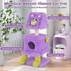 Whimsical purple monster-themed cat tower with two cozy condos, plush fabric, and playful hanging toys for cats.