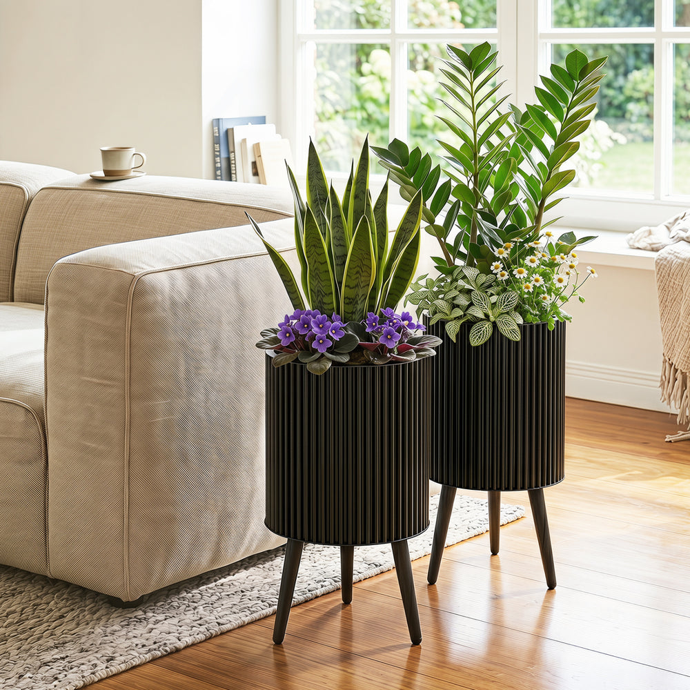 Set of 2 decorative flower pots with a modern fluted design, featuring drainage holes and sturdy metal legs for stability.