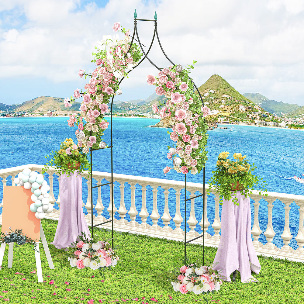 Decorative 9.5 feet metal garden arch adorned with flowers, perfect for weddings and outdoor party decorations.