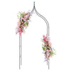 Decorative metal garden arch with pink floral arrangements, perfect for weddings and outdoor party decorations.