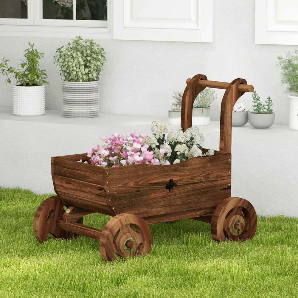Decorative wooden wagon cart in rustic brown with flowers, featuring wheels, handle, and drainage hole for garden use.