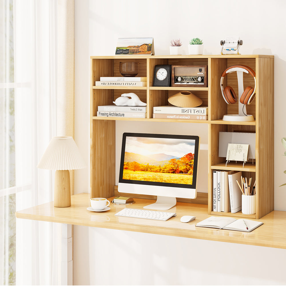 Desktop bookshelf in yellow with 7 open cubbies and 3 adjustable shelves, ideal for organizing a computer desk.