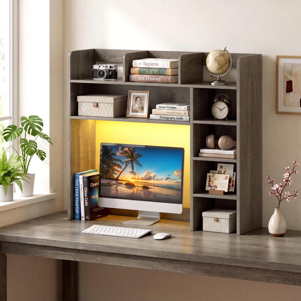 Desktop bookshelf with LED lights, oak finish, featuring adjustable shelves and monitor space for organized storage.