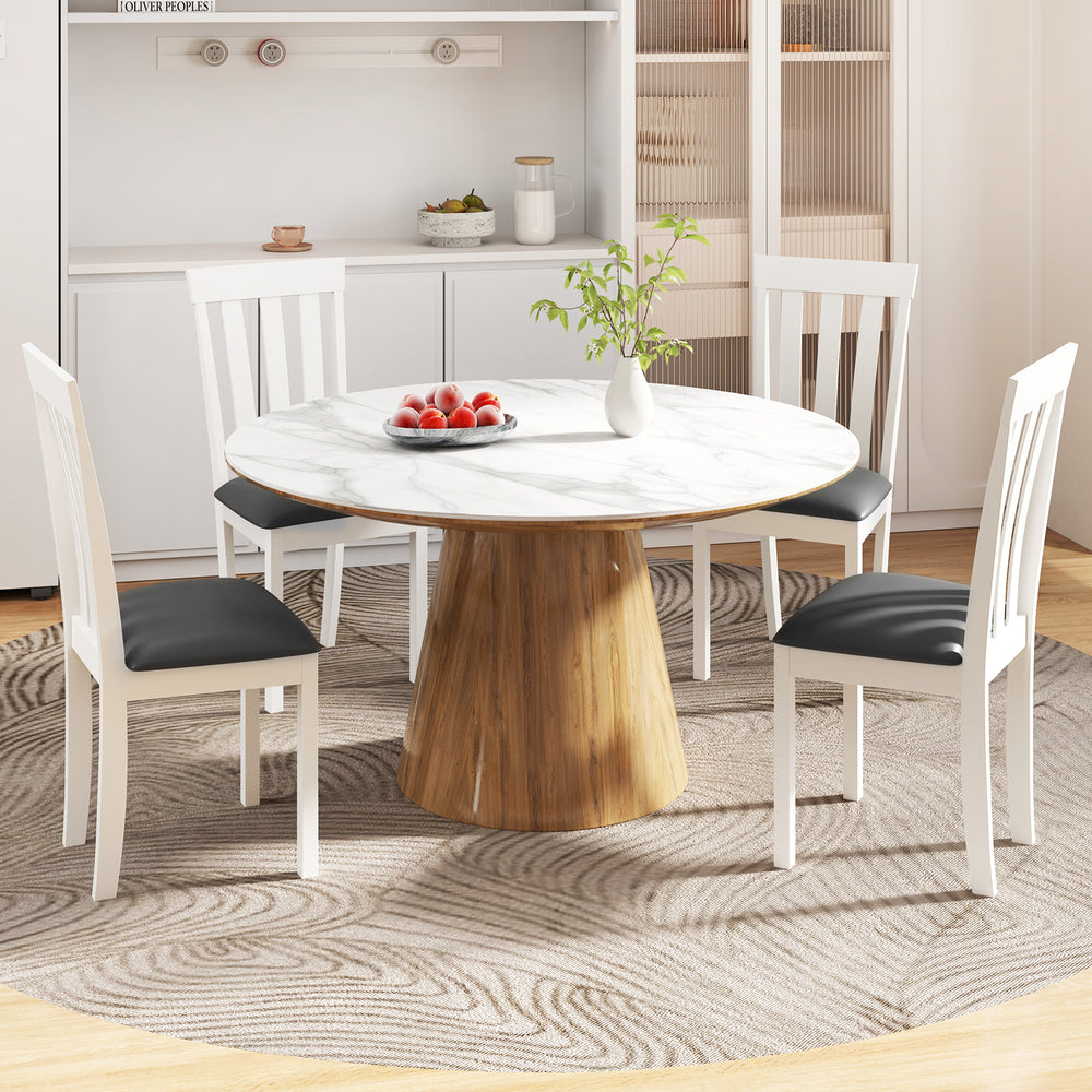 Round dining table with four white upholstered wooden chairs, featuring padded seats and a rubber wood frame for.