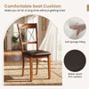 Dining chair with walnut rubber wood frame and waterproof PVC leather seat cushion for comfortable dining experiences.