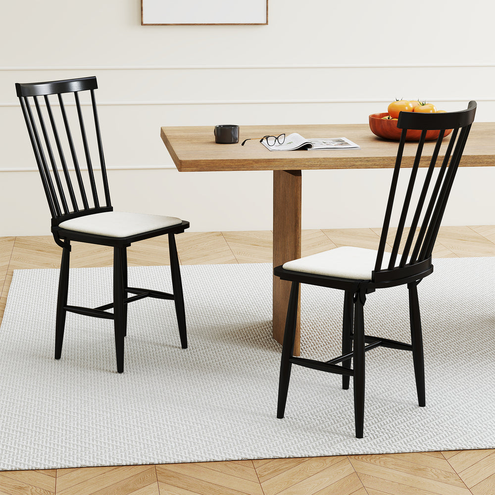 Two black farmhouse dining chairs with removable cushions, featuring solid rubber wood construction and ergonomic.