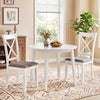 White rubber wood dining chairs with padded seats and backrests, perfect for comfortable dining experiences.