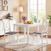 White rubber wood dining chairs with padded seats and backrests, designed for comfort in a cozy dining room setting.
