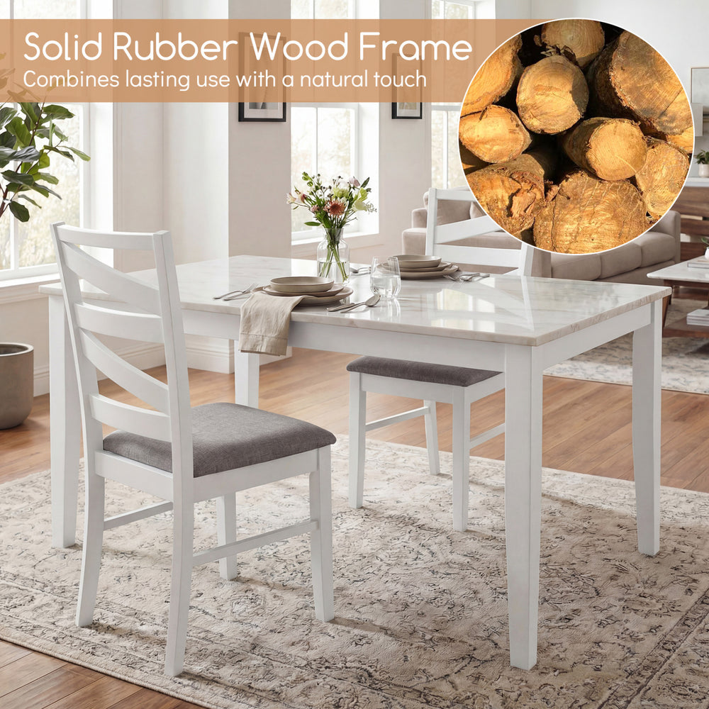 Set of 4 white dining chairs with rubber wood frames and breathable linen upholstery for kitchen or dining room use.