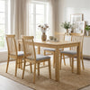 Natural rubber wood dining chairs with fabric upholstery and spindle backrest, ideal for kitchen or dining room use.