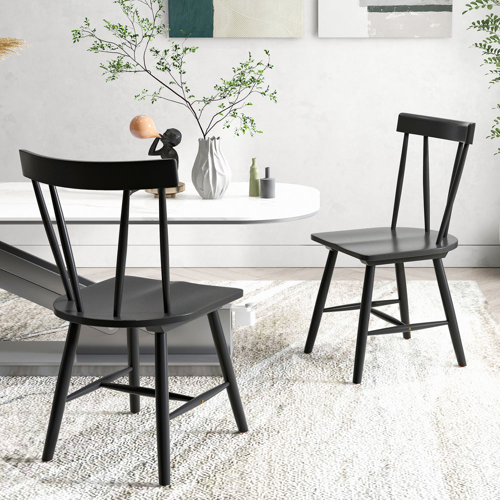 Windsor style armless chairs in black with solid rubber wood frame, perfect for dining or living room use.