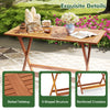 Patio dining table with slatted teak finish, X-shaped structure, and umbrella hole, ideal for backyard or poolside use.
