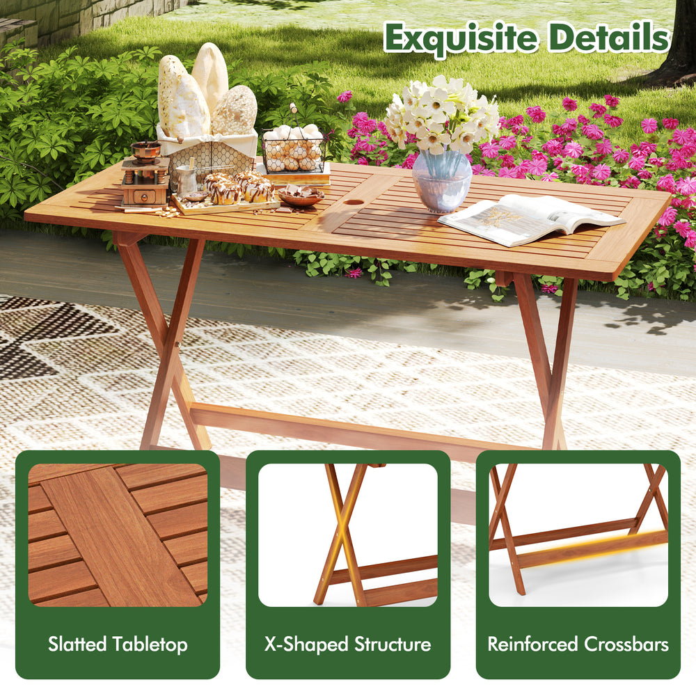 Patio dining table with slatted teak finish, X-shaped structure, and umbrella hole, ideal for backyard or poolside use.