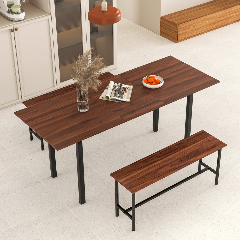 Extendable walnut dining table set with two benches, featuring a sturdy metal frame, ideal for 4-6 people.
