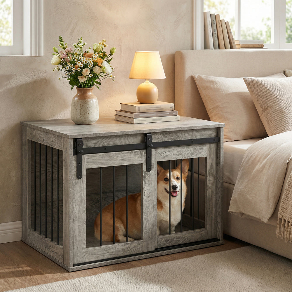 Dog crate furniture with sliding barn door in gray, ideal for small to medium dogs, serving as a stylish nightstand.