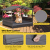 Outdoor wicker dog house with weatherproof roof and gray cushion, providing comfort and stability for pets.
