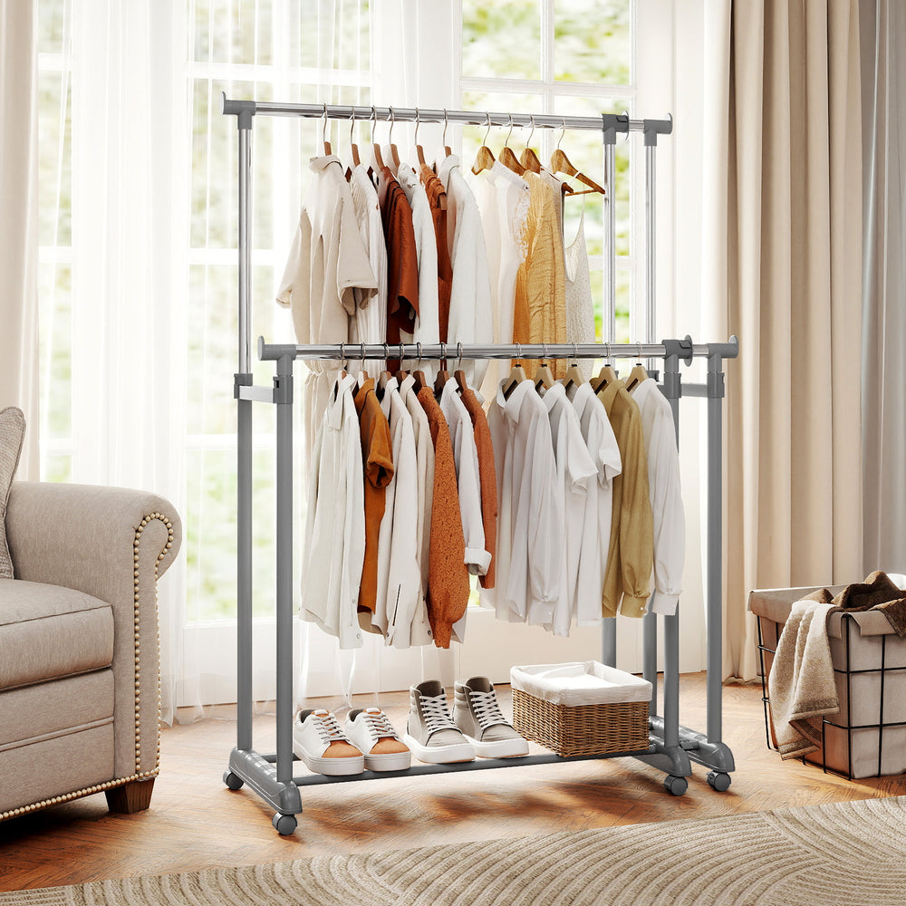 Double rod clothes rack showcasing heavy-duty metal design with ample storage, adjustable height, and smooth-rolling.