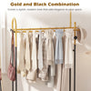 Double rods garment rack in gold and black with hanging clothes, side hooks, and bottom shelf for stylish storage.
