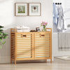 Double tilt-out laundry hamper made of natural bamboo with two removable bins and top storage shelf for bathroom.