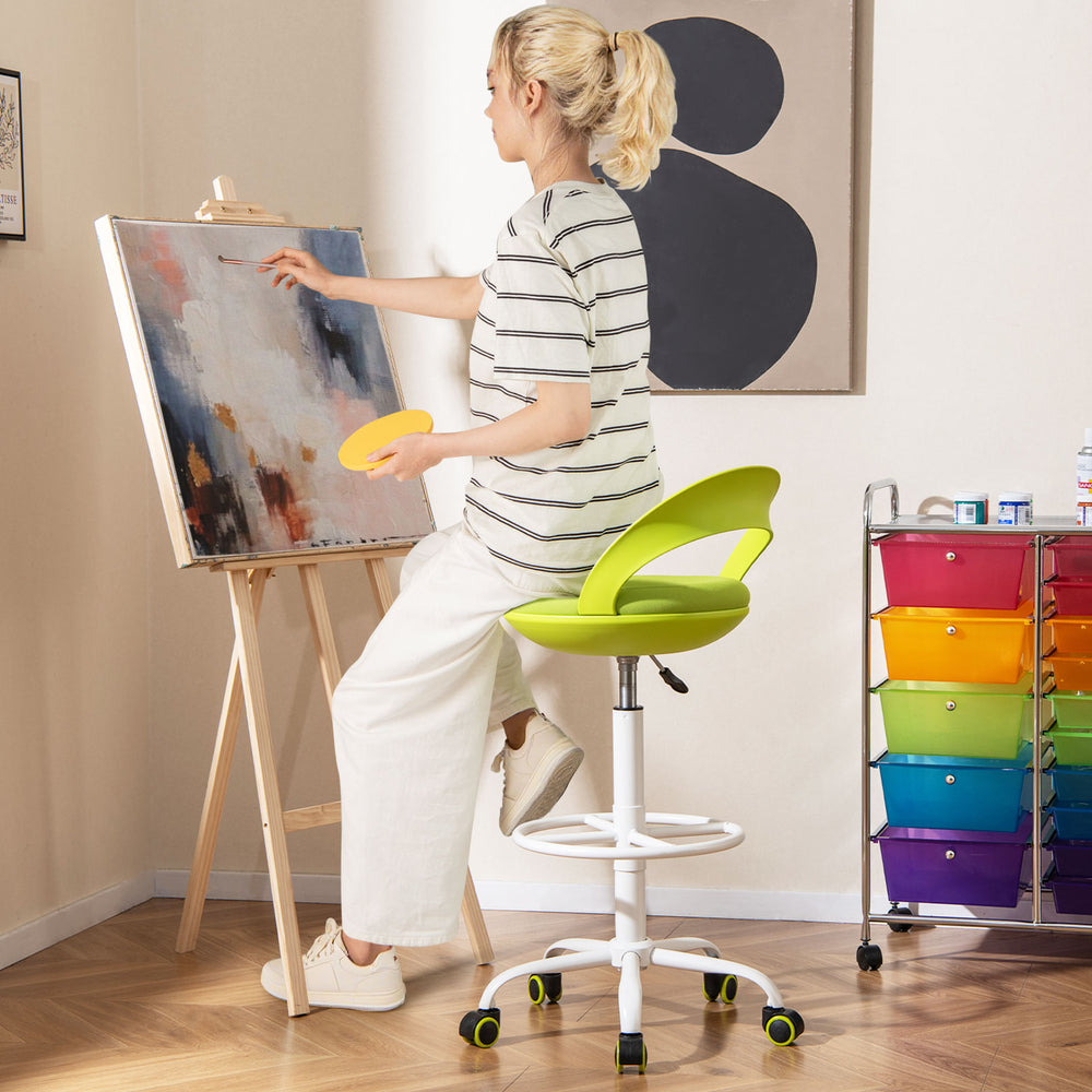 Drafting stool in green with wheels, featuring a breathable mesh seat and adjustable height, ideal for creative studios.
