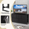 Dresser storage tower with five foldable black cloth drawers, featuring a sturdy metal frame and non-scratch foot pads.