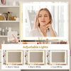 Vanity dressing table set with adjustable lights, clear mirror, and ample storage for makeup and accessories.