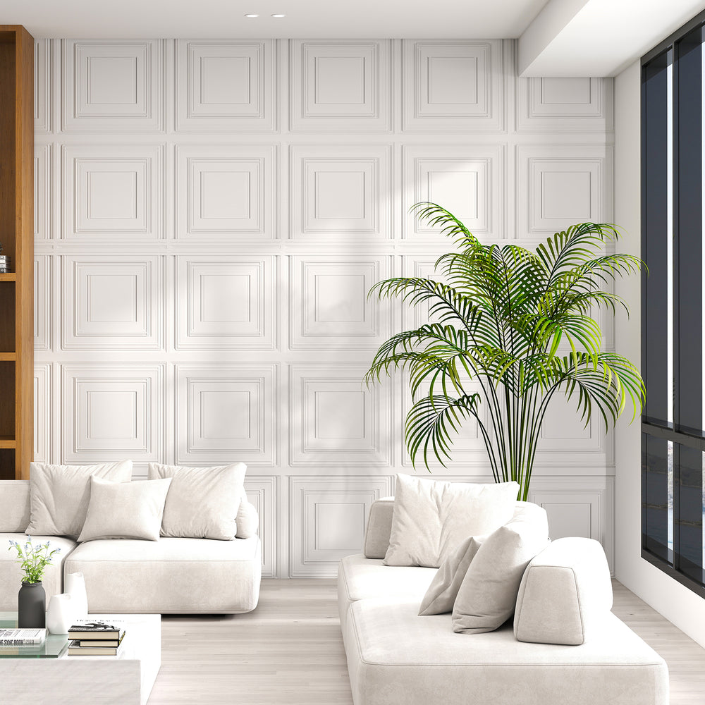 White 3D decorative PVC ceiling tiles in a modern living room, showcasing a stylish wall installation.