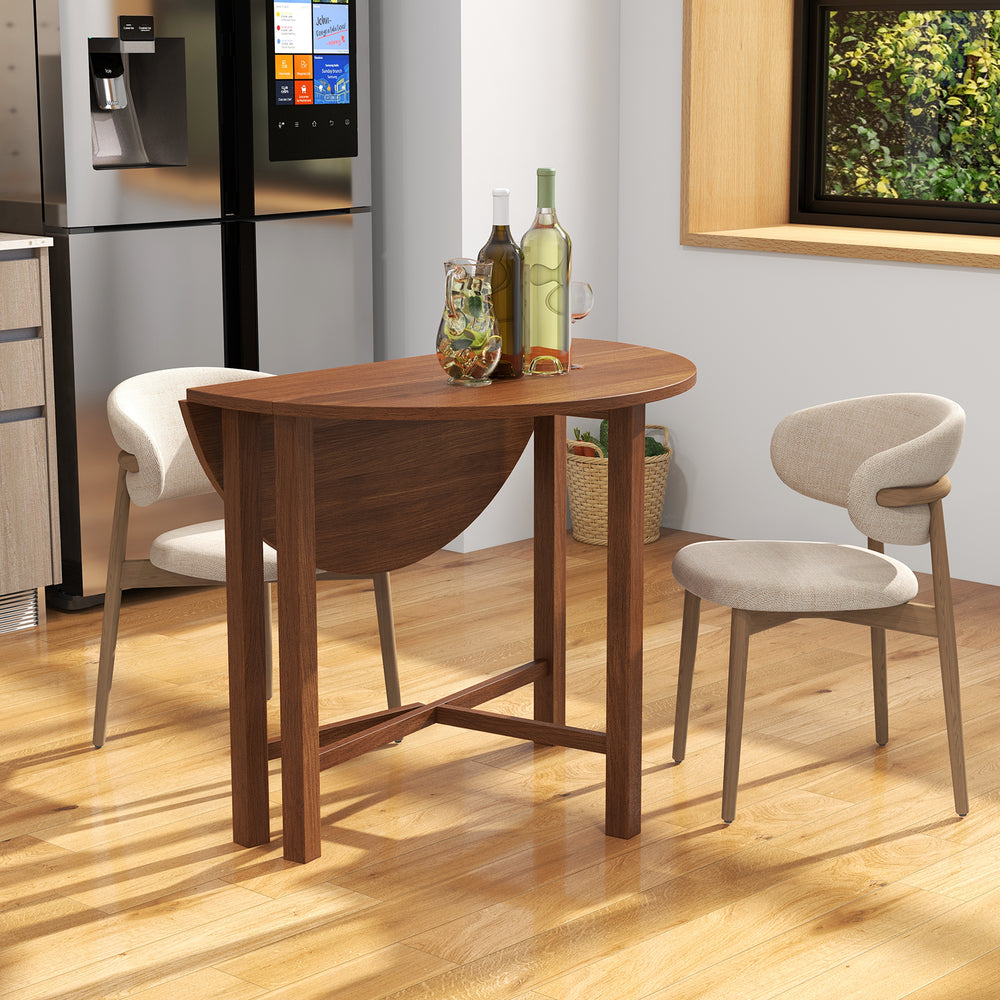 Walnut dual drop leaf dining table for small spaces, accommodating 2-4 people, with a foldable design and sturdy frame.