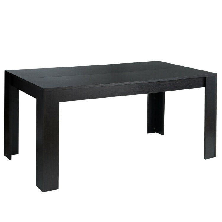 Black dining table with a large surface for six, designed for compact living and easy cleaning.