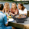 Electric BBQ grill with non-stick grilling plate, perfect for 10 people, shown in use outdoors with friends.