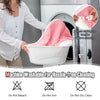 Electric heated blanket throw in pink being placed in a washing machine, featuring machine washable convenience.