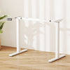 Height adjustable electric standing desk frame in white with LED display for ergonomic sit-to-stand use.