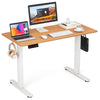 Electric standing desk with natural wood finish, featuring 3 memory height settings and 2 hanging hooks for.