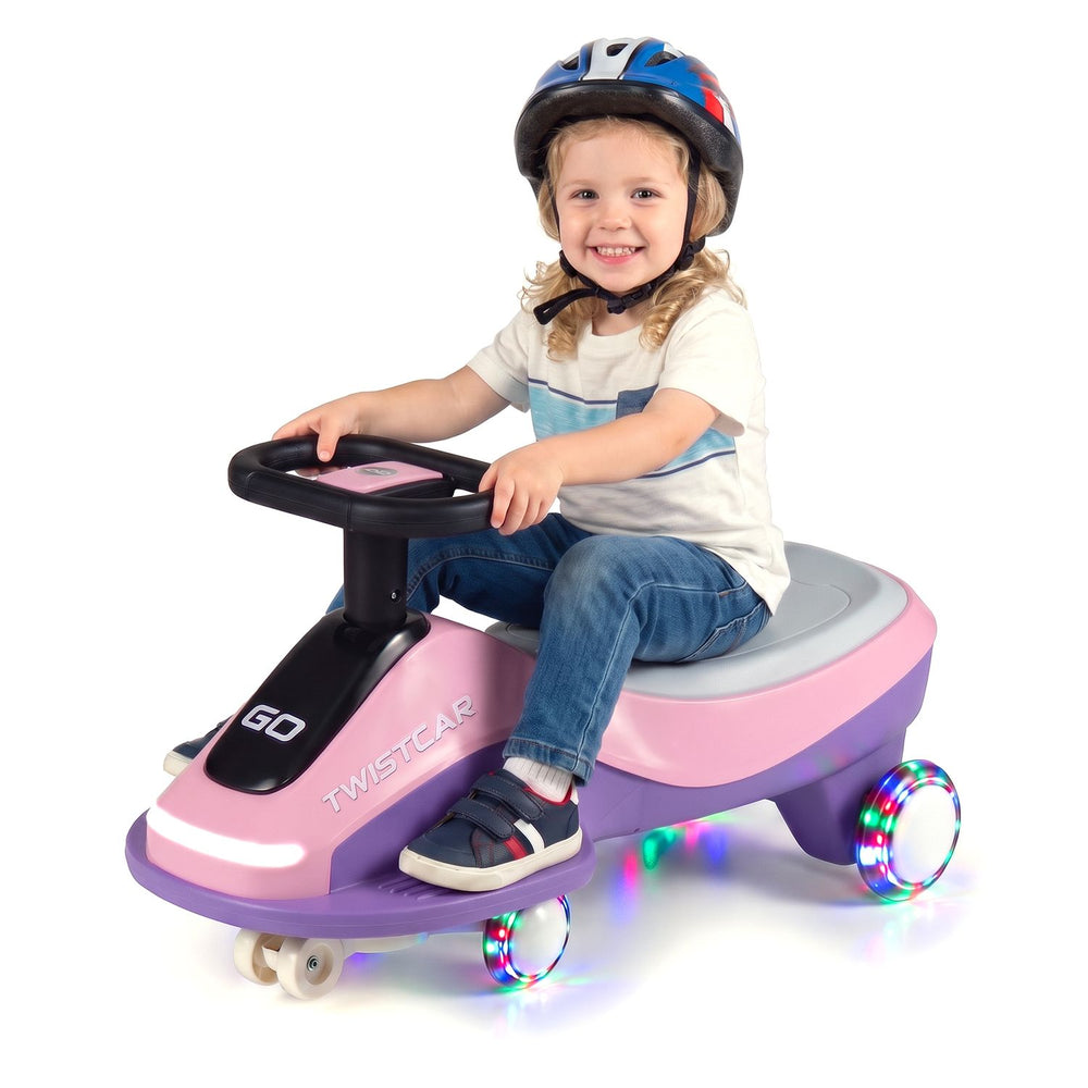 Electric wiggle car in pink and purple for kids, featuring flashing wheels, 360° steering, and a comfortable seat.