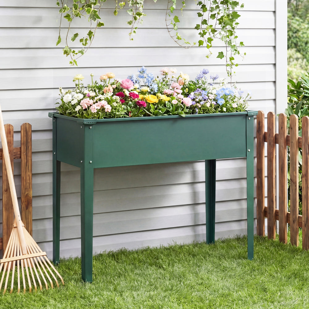 Elevated green metal raised garden bed with legs, featuring drainage holes, ideal for growing flowers and vegetables.