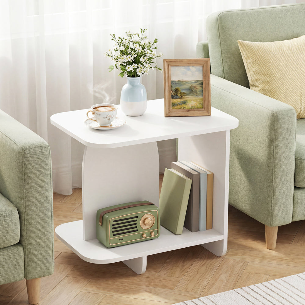 White 2-tier end table with rounded corners and storage shelves, ideal for small spaces in living rooms or bedrooms.
