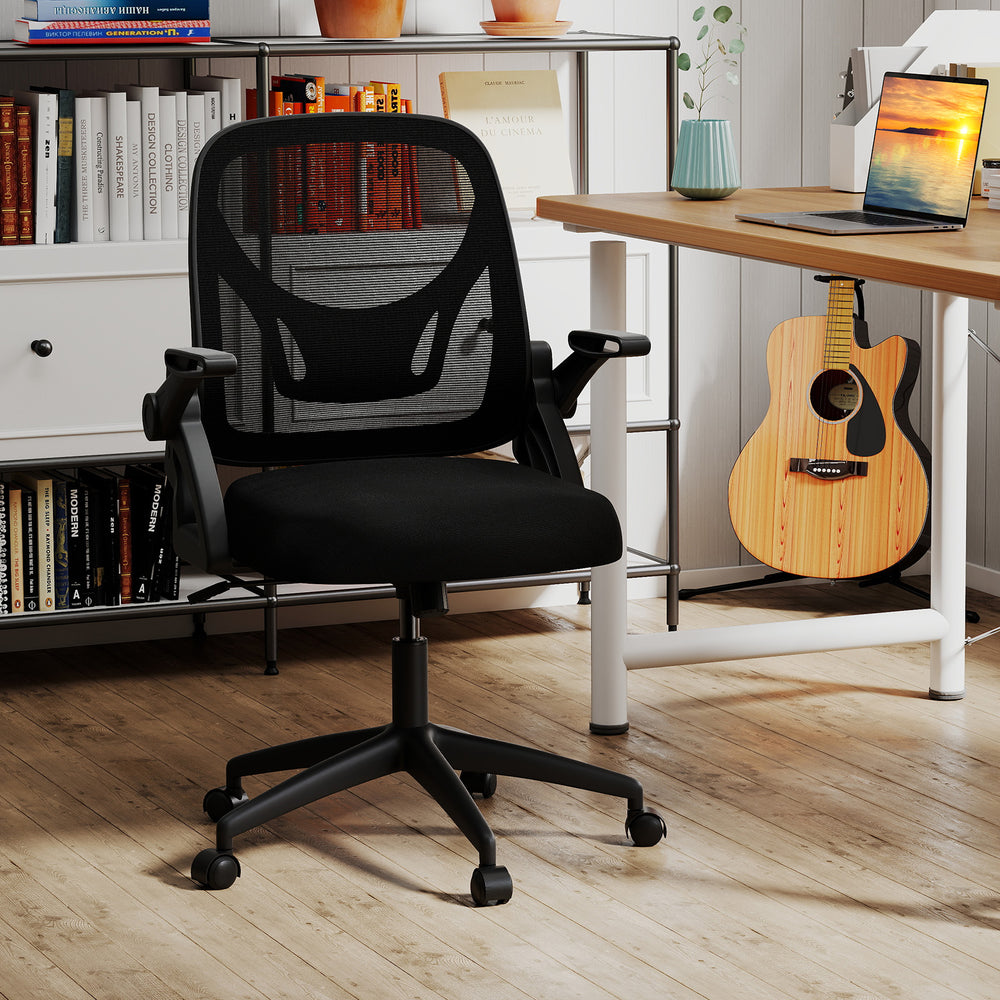 Ergonomic black computer desk chair with lumbar support and flip-up arms, designed for optimal comfort and mobility.