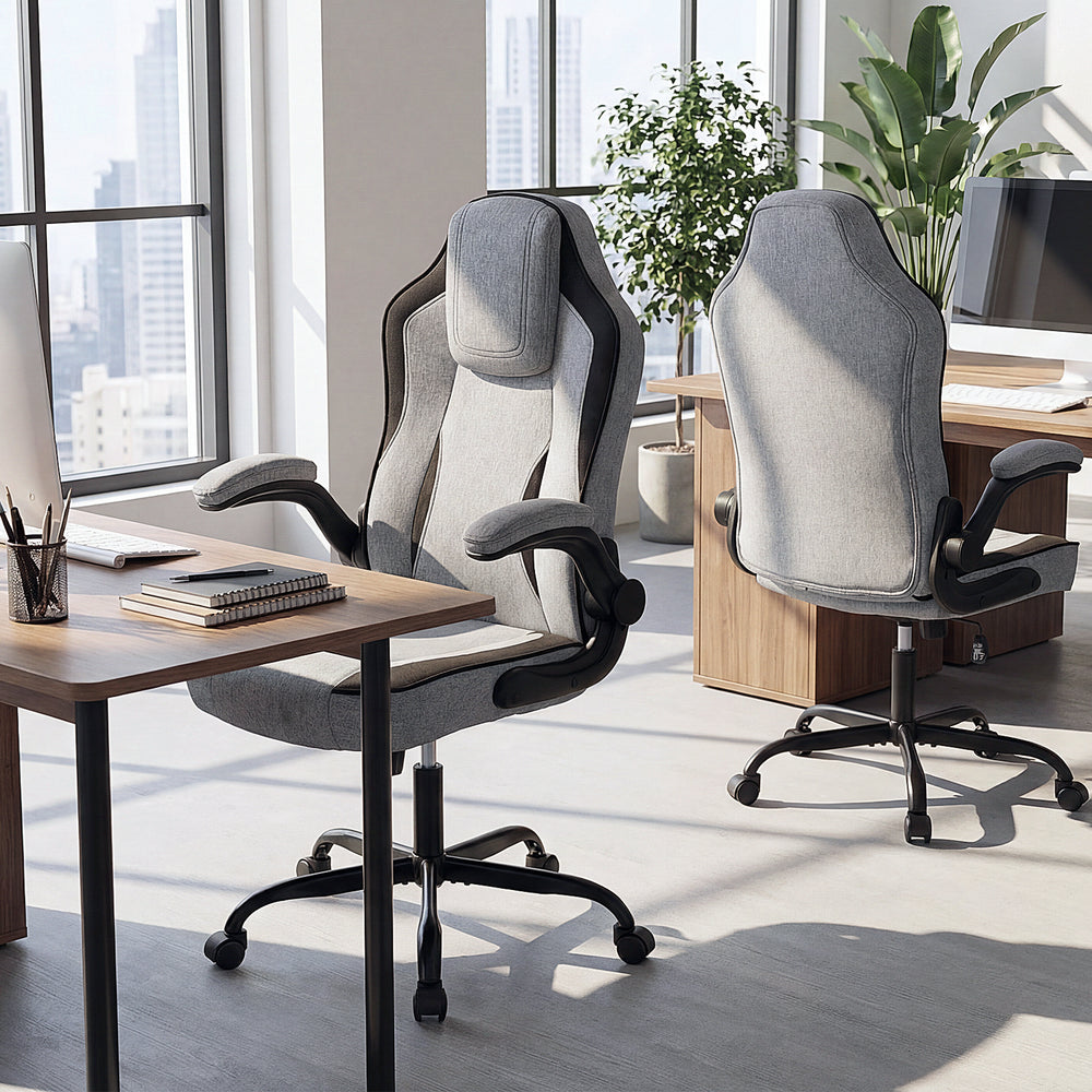 Ergonomic gray office chair with 90° flip-up armrests, designed for comfort and dynamic movement in a modern workspace.