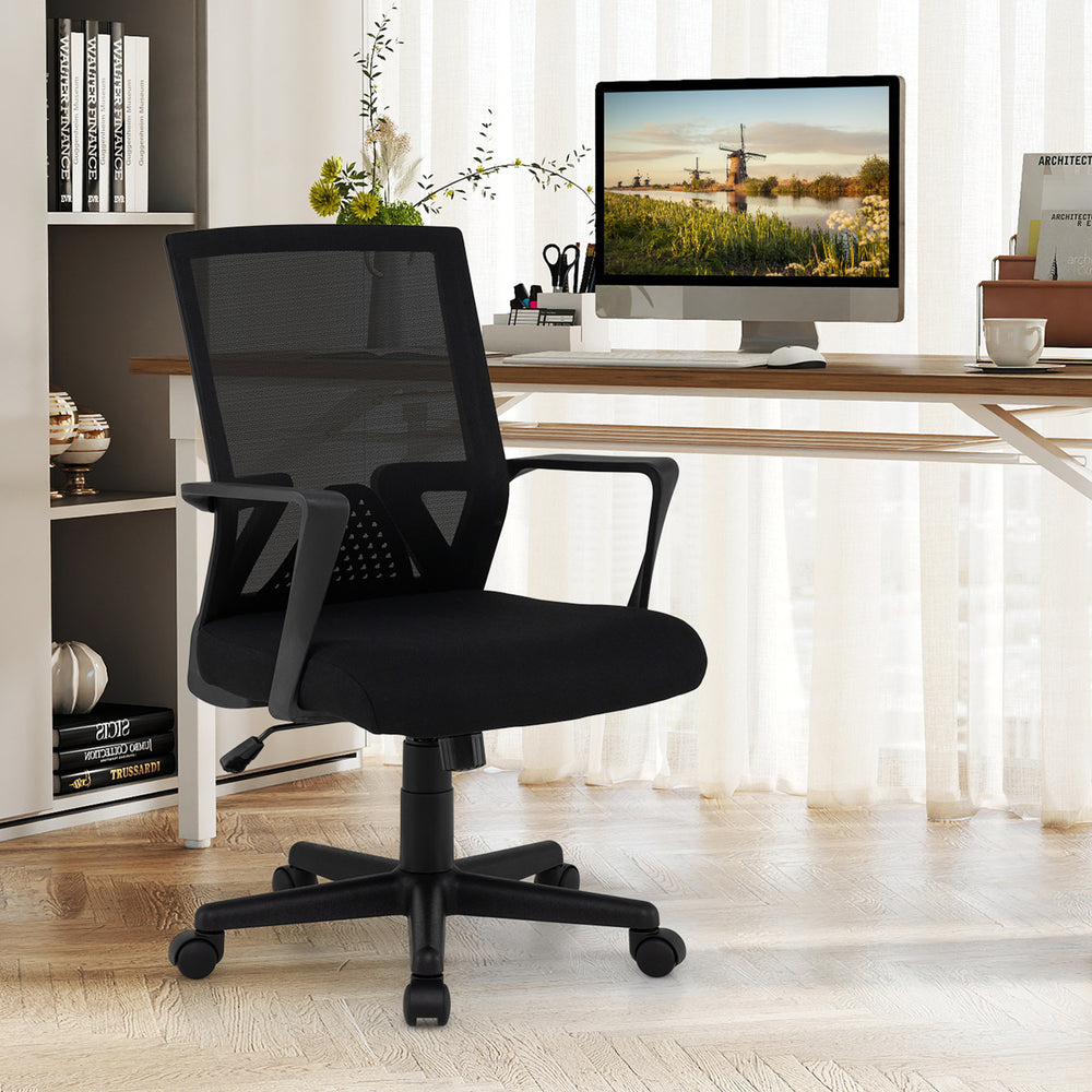 Ergonomic black desk chair with lumbar support, padded seat, and adjustable height for comfortable office use.