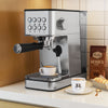 Compact stainless steel espresso machine with milk frother, featuring a 20-bar pump and 57oz removable water tank.