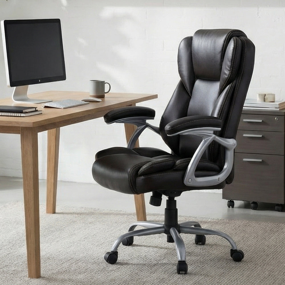 Brown ergonomic executive office chair with padded seat and armrests, adjustable height, and 360° swivel for comfort.
